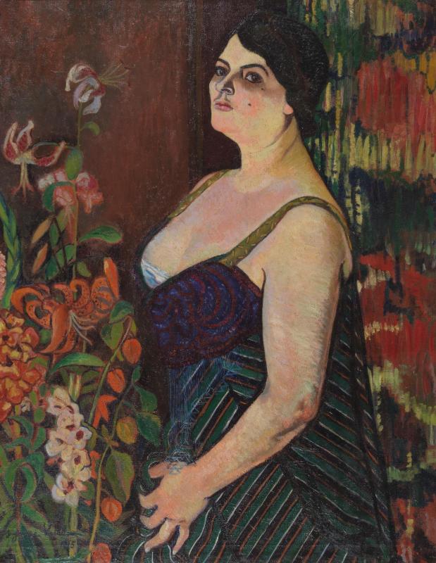 Suzanne Valadon Barnes Foundation: A three-fourths portrait of a white woman facing left. The woman wears a low-cut dress with blue and red swirls on the bodice, greenm red, black, and white diagonal stripes on the gown and with gold straps. On her left are pink, red, and white flowers and to her right is a curtain with a red, blue, and white pattern.
