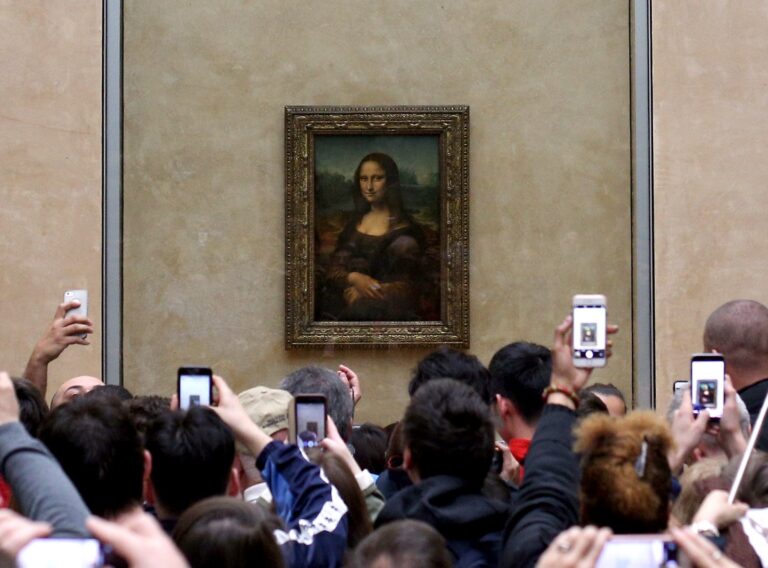 what makes an artwork famous: Mona Lisa by Leonardo da Vinci hanging at the Louvre, Paris, France. Vanity Fair.
