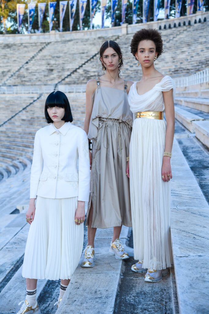 dior greece: Giovanni Giannoni, Campaign for Dior Cruise 2022 Collection featuring three models posing in the Panathenaic Stadium, Athens, Greece. GRAZIA.
