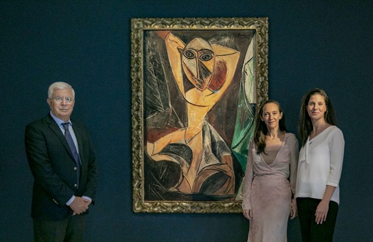 Goulandris Foundation: Foundation’s director Kyriakos Koutsomallis, Fleurette Karadontis and Marie Koutsomallis with Picasso’s Nude Woman with Raised Arms. Greek Travel Pages.
