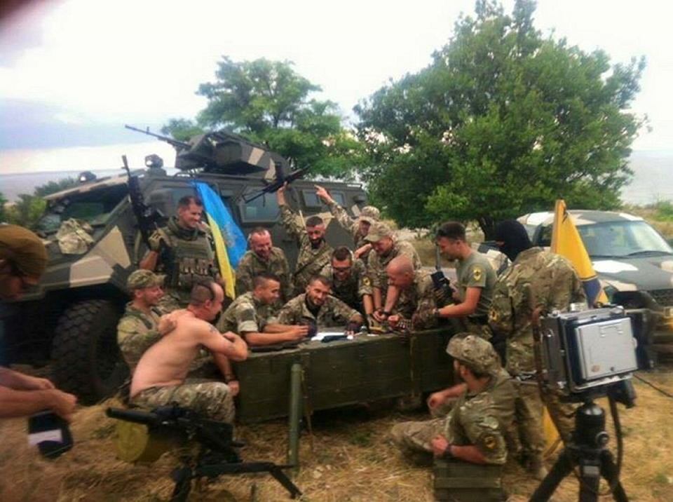 Reply of the Zaporozhian Cossacks: Ukrainian soldiers recreating Repin’s painting, probably 2015. Imgur.
