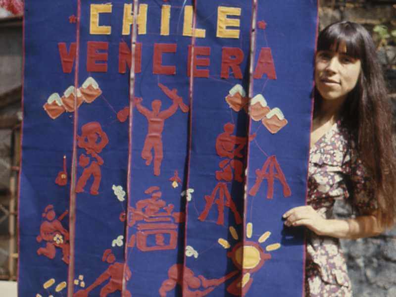 Cecilia Vicuña: Cecilia Vicuña with Chile Vencerá banner, 1974 c. John Dugger Archive/Tate.
