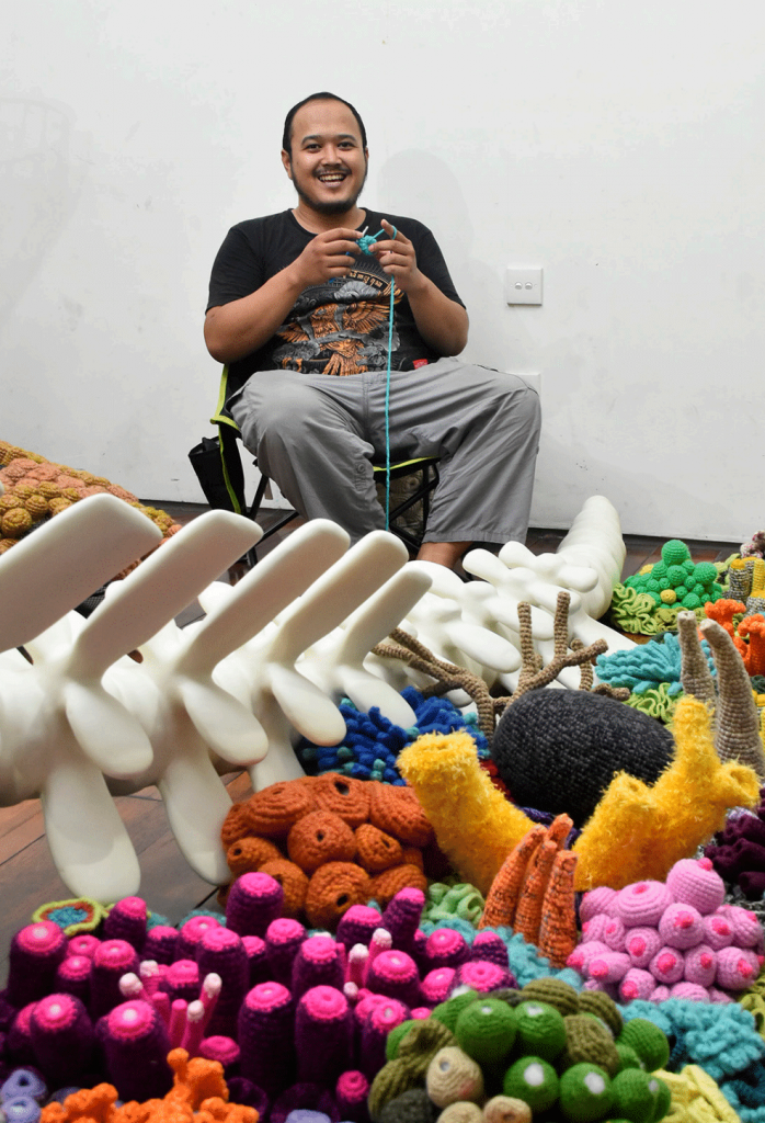 Mulyana: Photo of the artist Mulyana working on an installation. Courtesy of SAPAR Contemporary.
