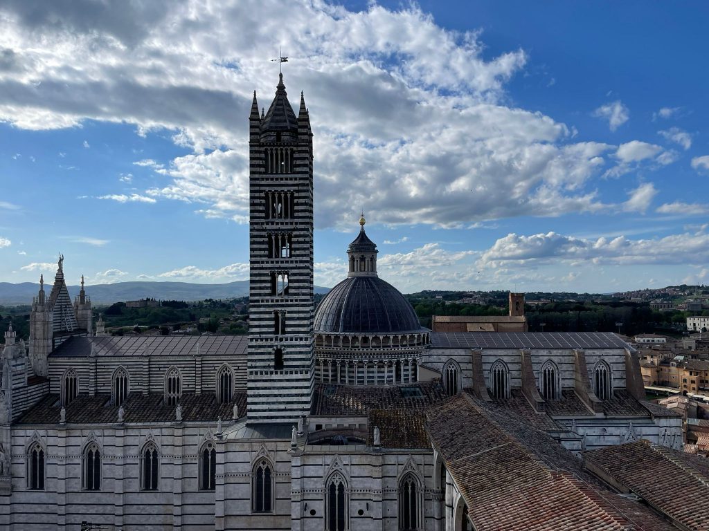 duomo Siena: View of the Duomo from the Facciatone, Siena, Italy, April 2022. Photograph by Kate Wojtczak.
