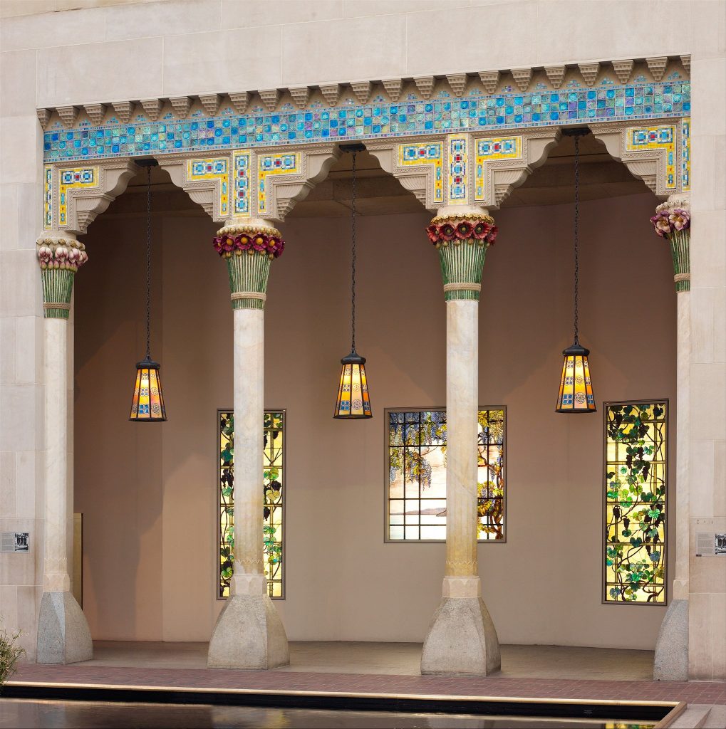 Tiffany's glass windows and lamps embedded into architecture.