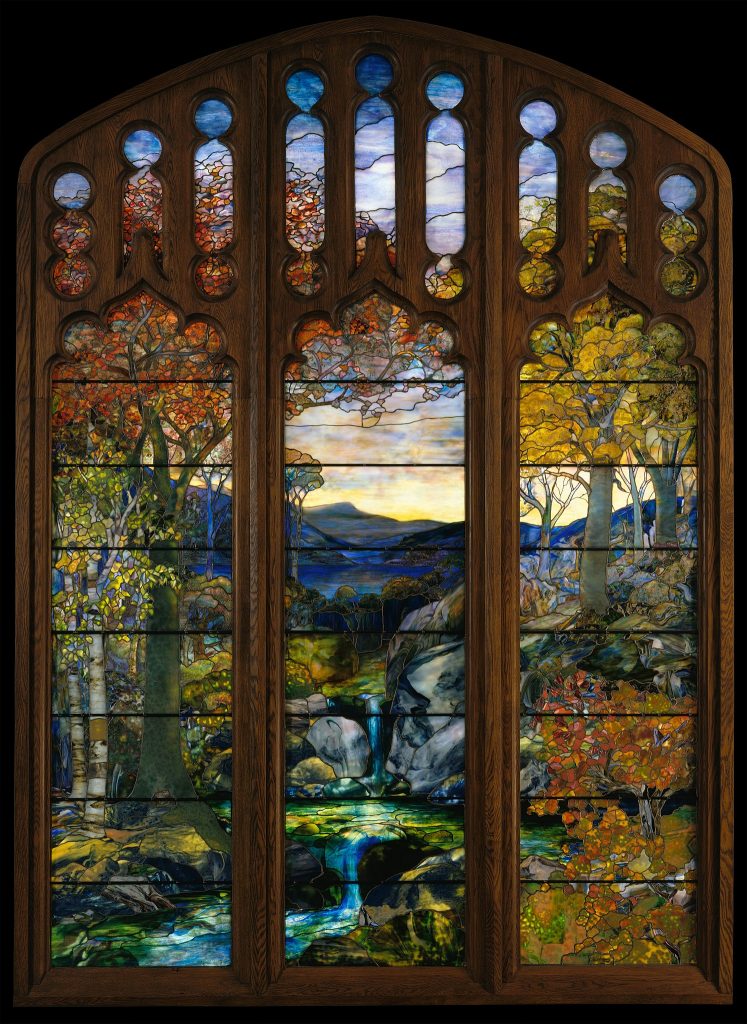 Tiffany's glass window pane depicting a landscape and waterfall.