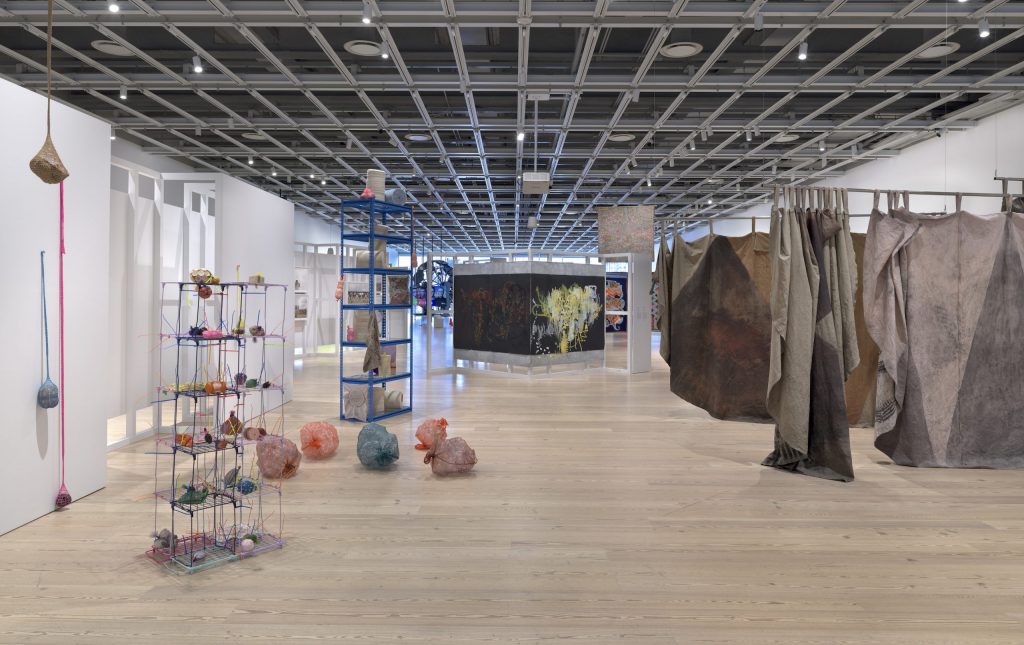 Whitney Biennial 2022: Installation view of Whitney Biennial 2022: Quiet as It’s Kept, Whitney Museum of American Art, New York, NY, USA, from left to right: Veronica Ryan, Between a Rock and a Hard Place, 2022; Awilda Sterling-Duprey, . . . blindfolded, 2020–; Duane Linklater, a selection from the series mistranslate_wolftreeriver_ininîmowinîhk and wintercount_215_kisepîsim, 2022. Photograph by Ron Amstutz.
