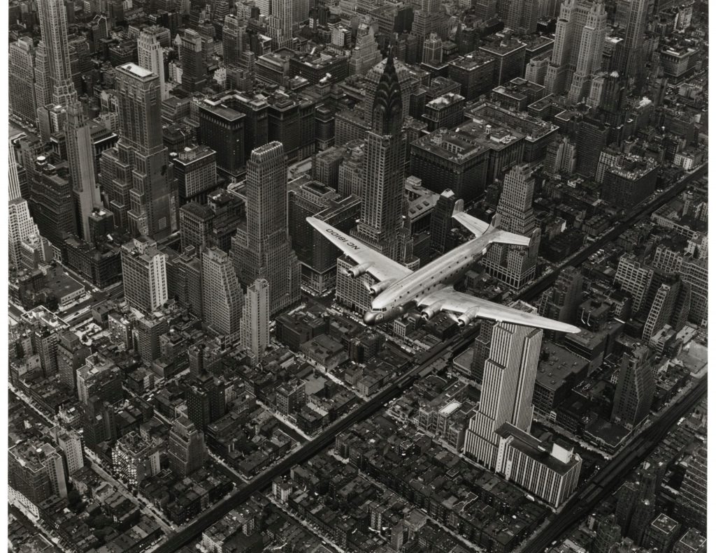 female photographers: Margaret Bourke-White, A View of an Airplane Flying Over Manhattan, 1939. Holden Lutz Gallery.

