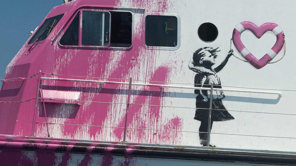 banksy refugees: Banksy, Louise Michel, detail, 2020, Mediterranean Sea. Surfacemag.com.
