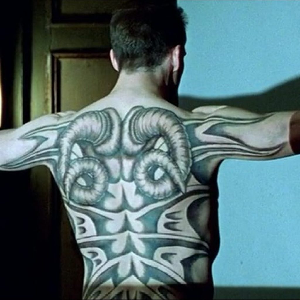 William Blake red dragon: Movie still from Red Dragon, Actor Ralph Fiennes as Francis Dolarhyde with Blake’s Red Dragon tattoo, directed by Brett Ratner, 2002. Tattoodo.com.
