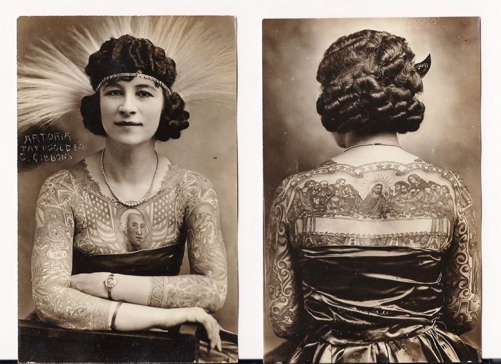 A black and white photograph showing the side-by-side of the front and back of a Caucasian woman wearing a bodice and tattoos on her arms and chest.