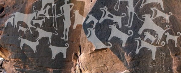 Pets in Art: Prehistoric rock panel with dogs, Saudi Arabia.