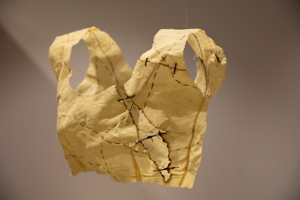Pritika Chowdhry: Pritika Chowdhry, Ringa Ringa Roses II, Tea-dyed khaddar cotton, burnt map lines, wire, wax. Courtesy of the South Asia Institute.
