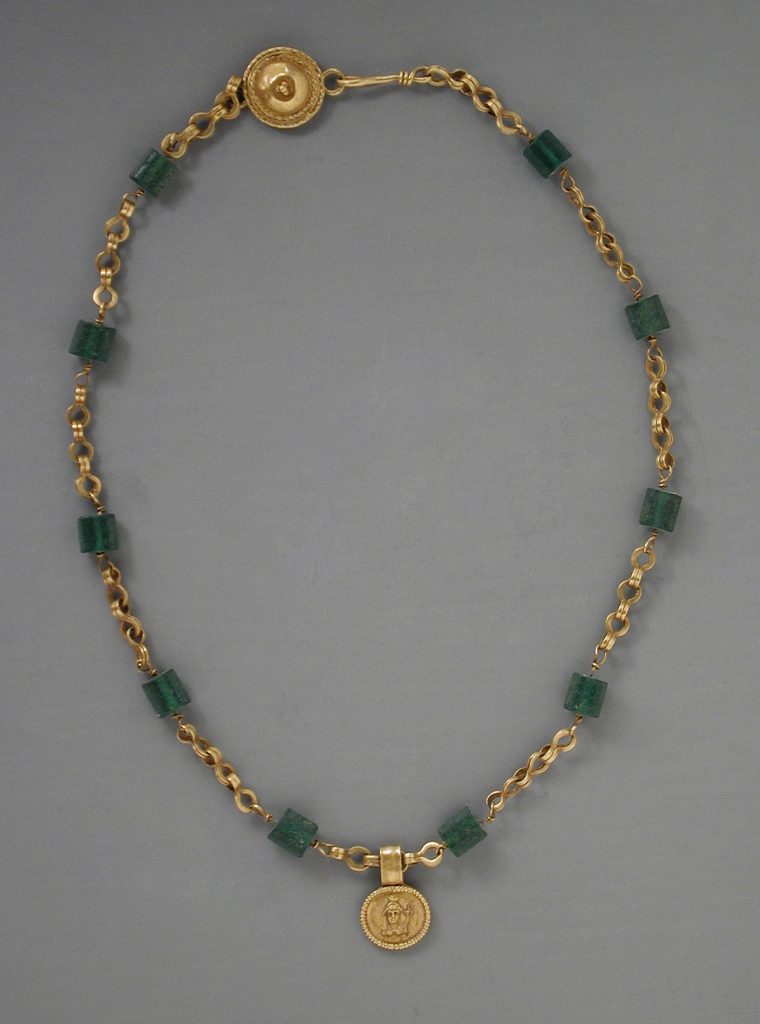 ancient egypt jewelry: Gold necklace with a medallion depicting a goddess, 30 BCE to 300 CE, Los Angeles County Museum of Art, Los Angeles, CA, USA.
