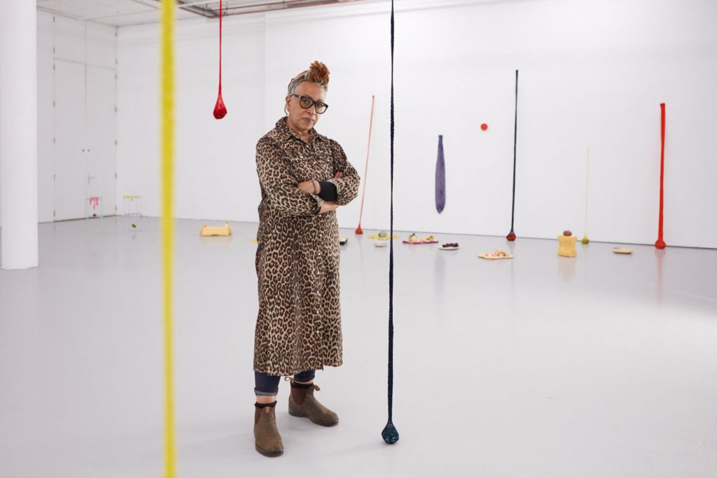 Black Female Artists: Portrait of Veronica Ryan with her exhibition, Along a Spectrum, Spike Island, Bristol (2021). 
Ph. Max McClure. Copyright Veronica Ryan. Courtesy Spike Island.