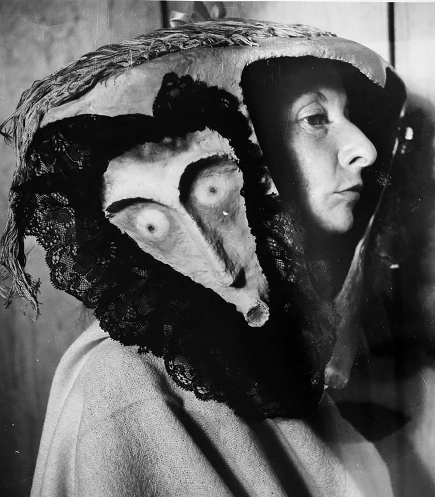 Remedios Varo: Kati Horna, Portrait of Remedios Varo wearing a mask by Leonora Carrington, 1957, Museo Amparo, Puebla, Mexico.

