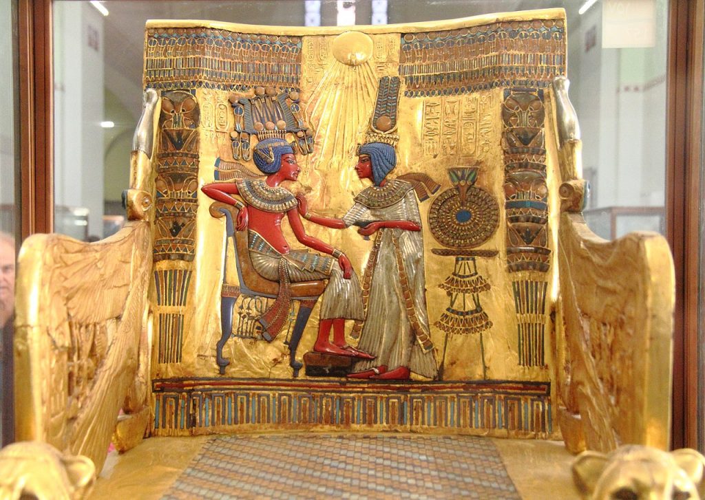 Tutankhamun: View of the Gilded Throne of Tutankhamun with depictions of the Aten. Photograph by Djehouty at the Egyptian Museum, Cairo via Wikimedia Commons (CC-BY-SA-4.0).
