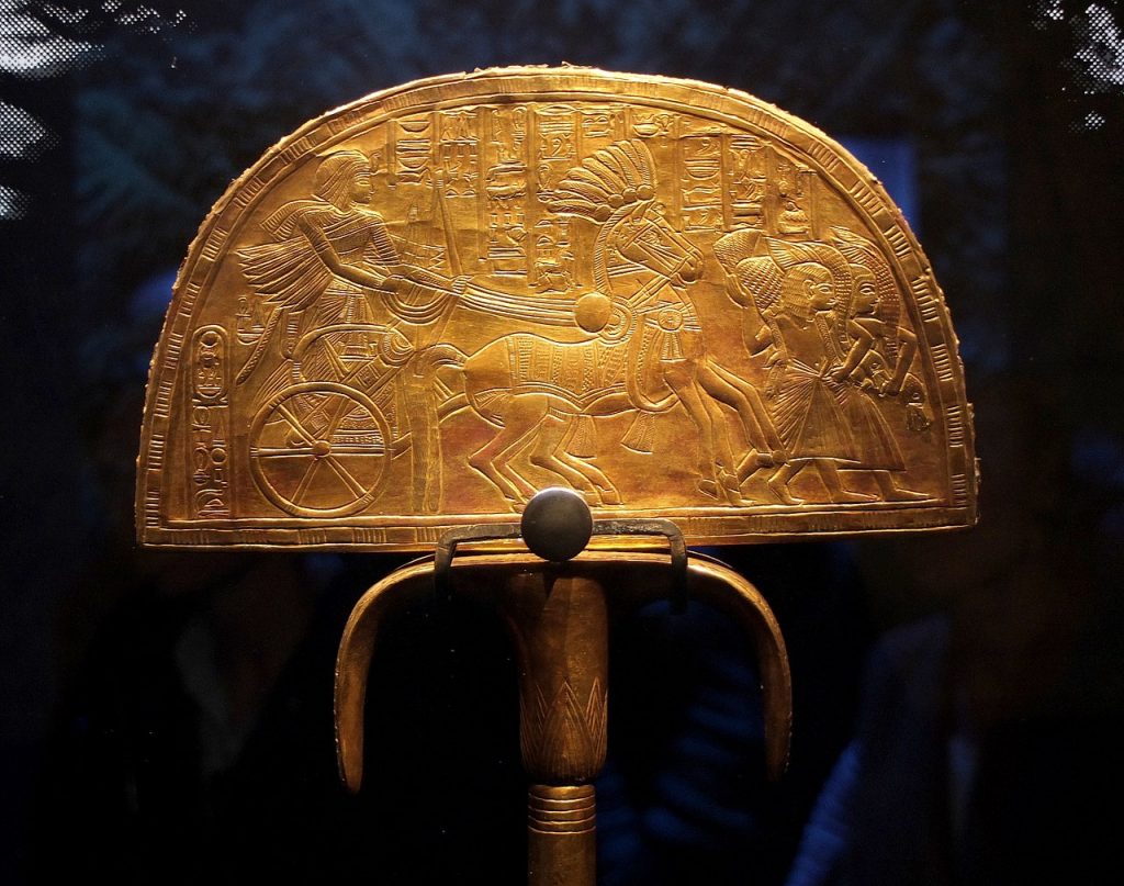 Tutankhamun: Golden fan found in Tutankhamun tomb,  14 th c. BCE, Egypt. Photograph by Siren-Com via Wikimedia Commons (CC-BY-SA-4.0).
