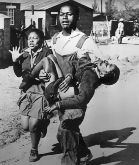 Apartheid art: Hector Peterson carrying Mbuyisa Makhubu in Soweto. Photographed by Sam Nzima, 1976 via Shaped.
