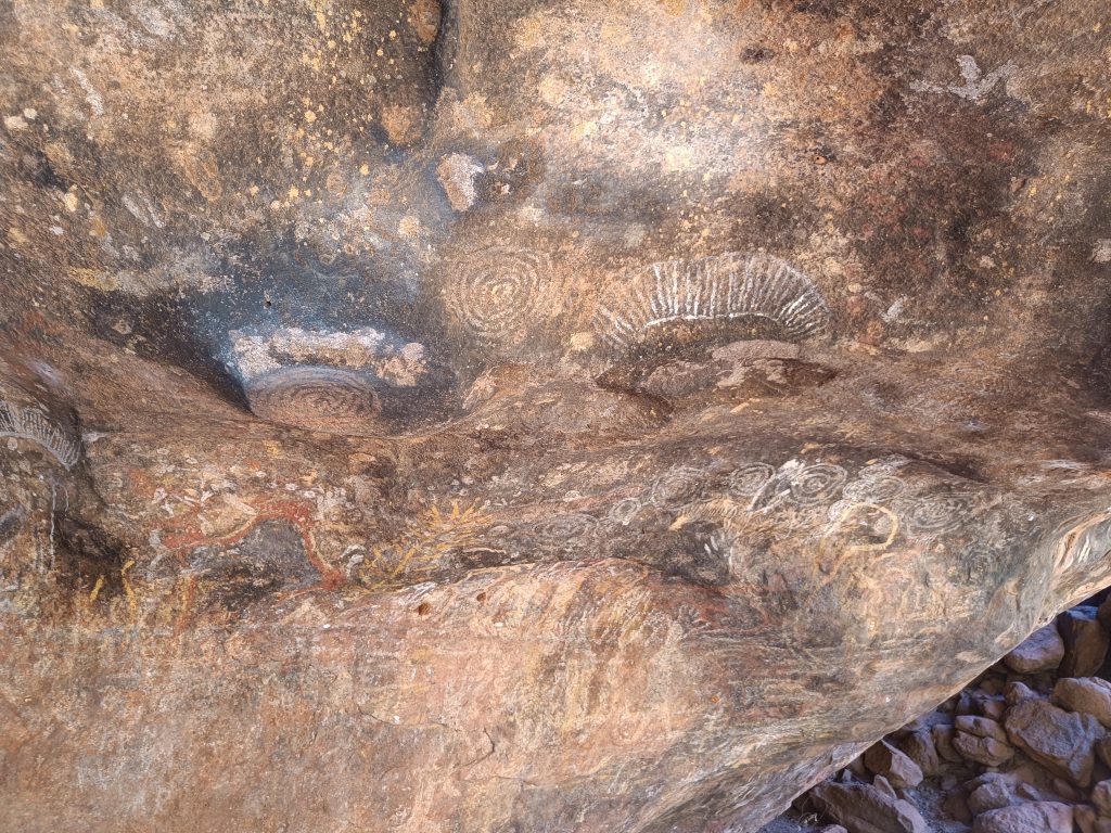 Indigenous Australian: Symbols from 30 000 BCE to today, Caves in Uluru, CA, Australia. Photographed by the author.
