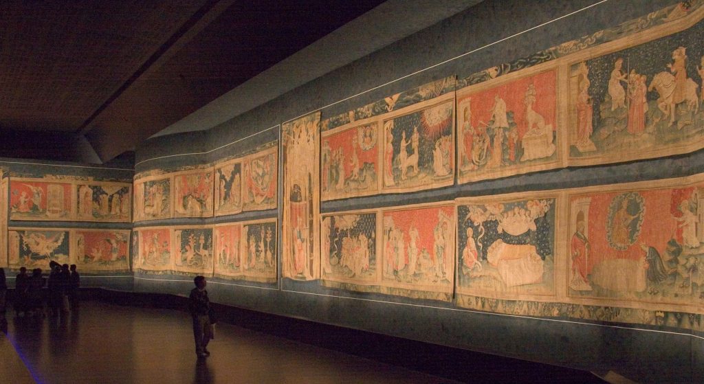 Medieval artists: Jean Bondol (designer) and Nicholas Bataille (weaver), The Apocalypse Tapestry, 1377-1382, Musée de la Tapisserie, Angers, France. Photo by Kimon Berlin via Wikimedia Commons (CC BY-SA 3.0).
