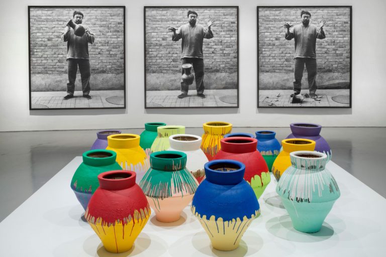 Ai Weiwei in 10 artworks: Ai Weiwei, Dropping a Han Dynasty Urn, 1995/2009 and Colored Vases, 2007-2010. Installation view of Ai Weiwei: According to What?, 2012, Hirshhorn Museum and Sculpture Garden, Washington, DC, USA. Photograph by Cathy Carver.
