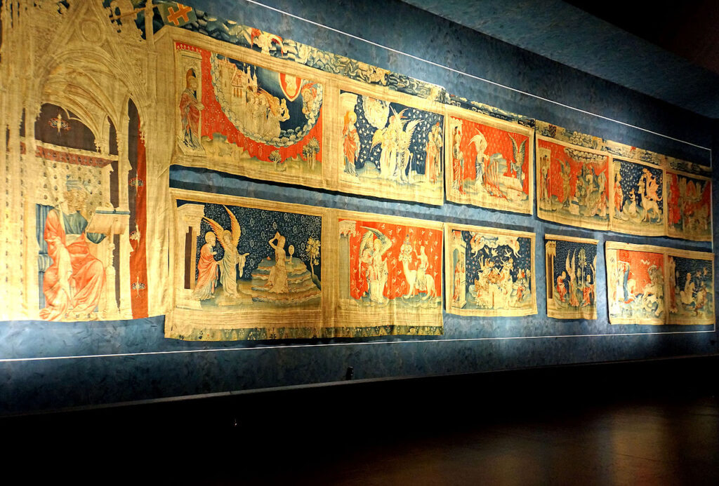 famous tapestries: Jean Bondol and Nicholas Bataille, Apocalypse Tapestry, 1377-1382, Château d’Angers, Angers, France. Photograph by Dennis Jarvis via Wikimedia Commons (CC BY-SA 2.0).
