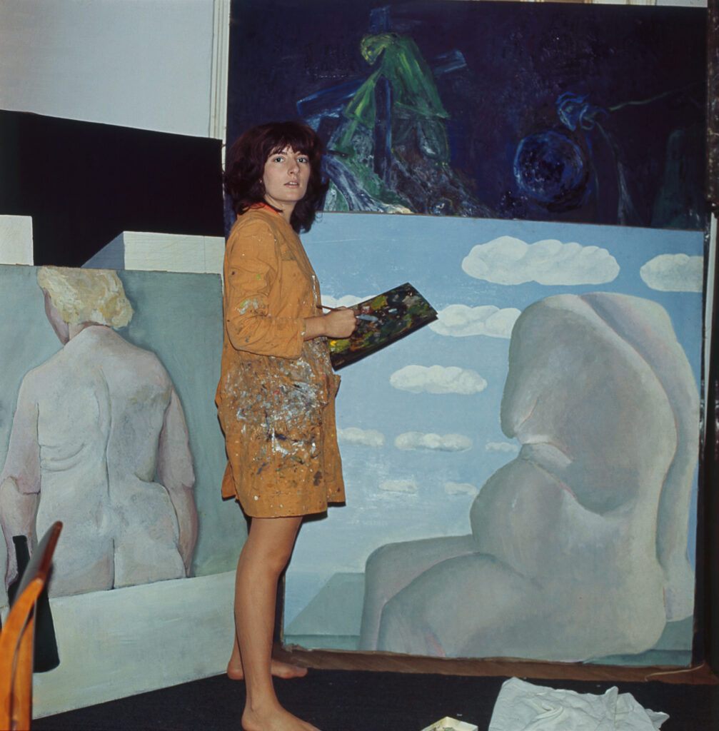 Marina Abramović - A Visual Biography: Marina painting in her studio, Belgrade, 1969, © Marina Abramović, Courtesy of the Marina Abramović Archives.

