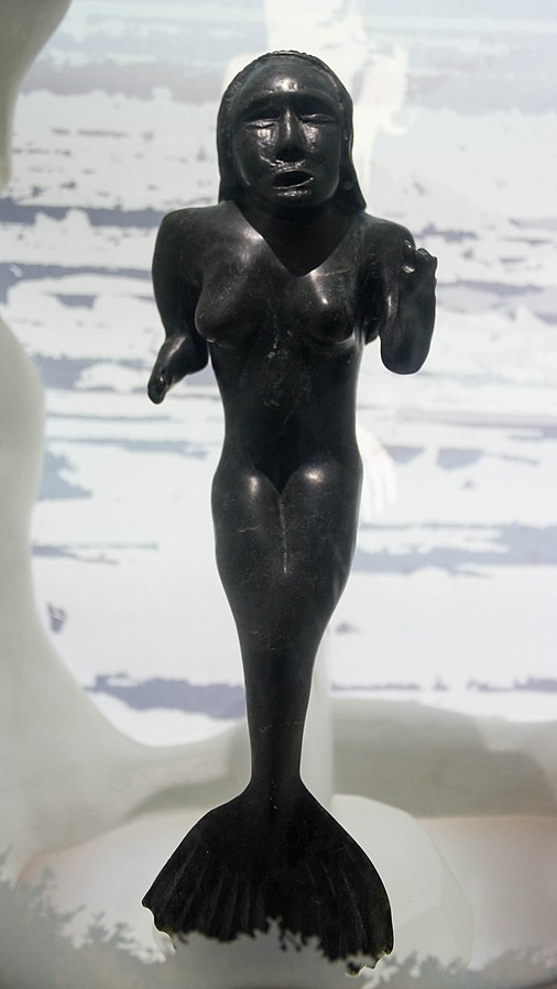 queer mythological characters: Nuvualiak Alariak, Sedna, Ivujivik, Oceanopolis, Brest, France. Photo by Léna via Wikimedia Commons (CC BY-SA 4.0).
