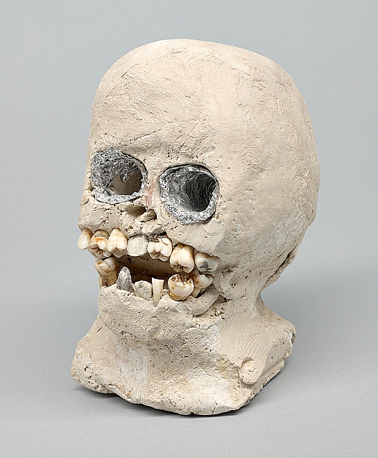black folk artists: James ‘Son Ford’ Thomas, Skull, 1988, unfired clay, human teeth, rocks, aluminum foil. Souls Grown Deep Foundation.
