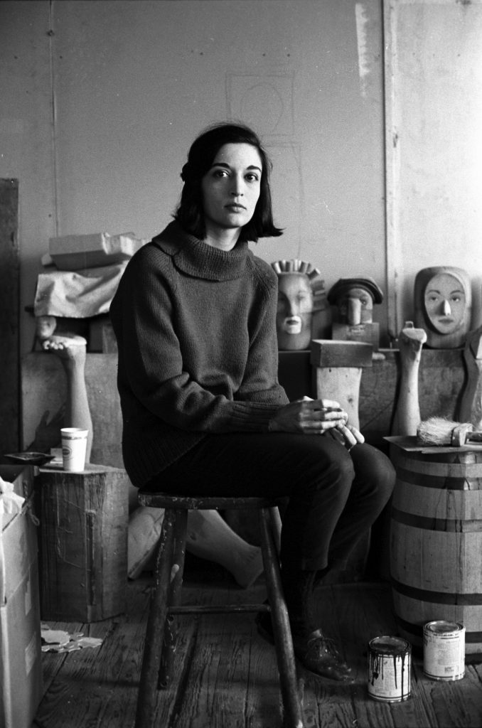 Marisol Escobar: Marisol Escobar in her studio, 1963. Art News.
