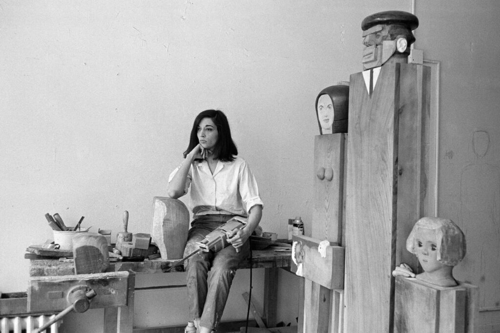 Marisol Escobar: Marisol Escobar in her studio with her sculpture “The Kennedy Family,” 1964. New York Times.

