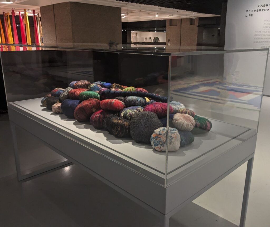 Unravel Barbican: Sheila Hicks, Family Treasures, 1993, exhibition view of Unravel: The Power and Politics of Textiles in Art, Barbican, London, UK. Photograph by Barbara Bravi.
