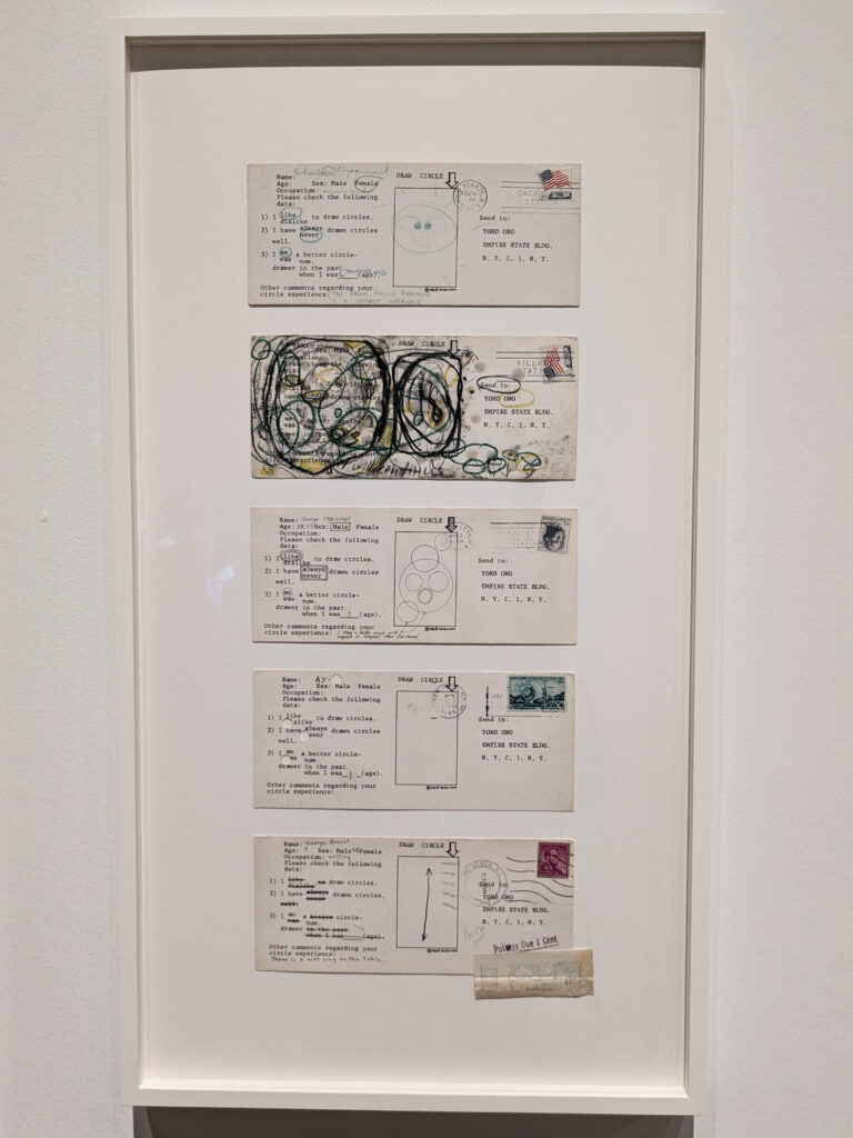 yoko ono exhibition: Yoko Ono, Draw Circle Event, 1964-5, Tate Modern, London, UK. Photograph by Barbara Bravi. Selection of 5 postcards responses sent by the following artists: Charlotte Moorman, Carolee Schneemann, George Maciunas, Ay-O, George Brecht.
