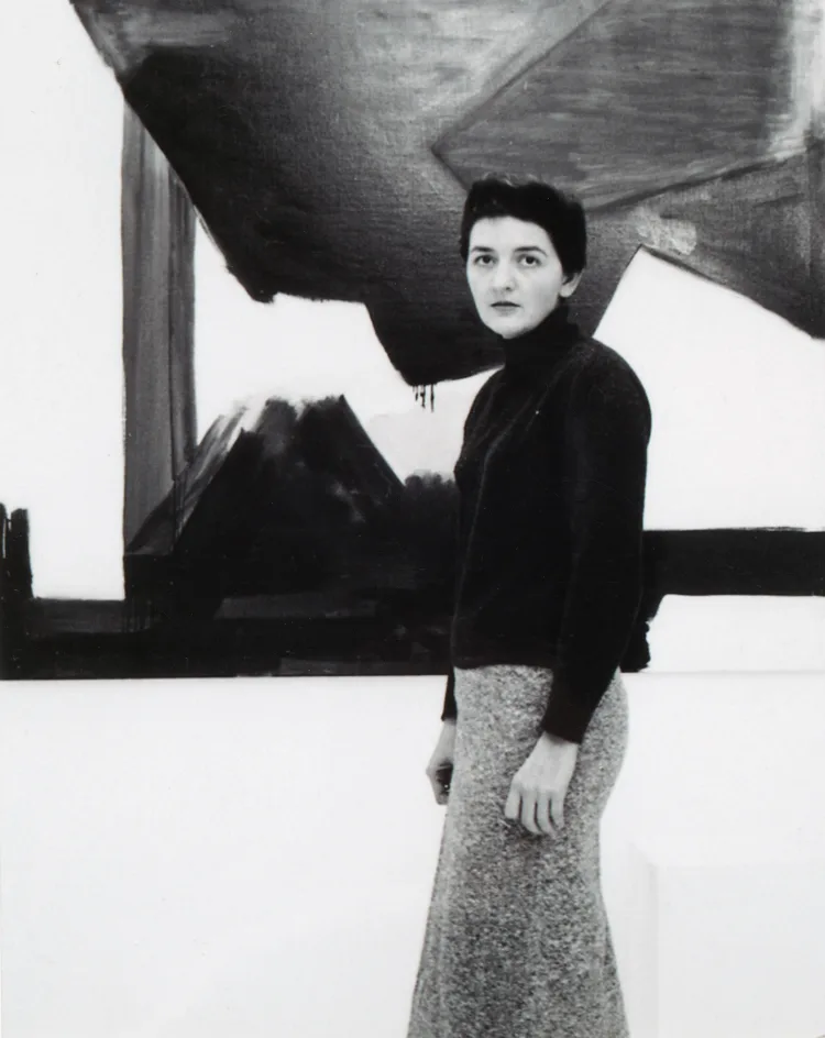 Judith Godwin: Photograph of Judith Godwin in front of her artwork. Pippy Houldsworth Gallery.
