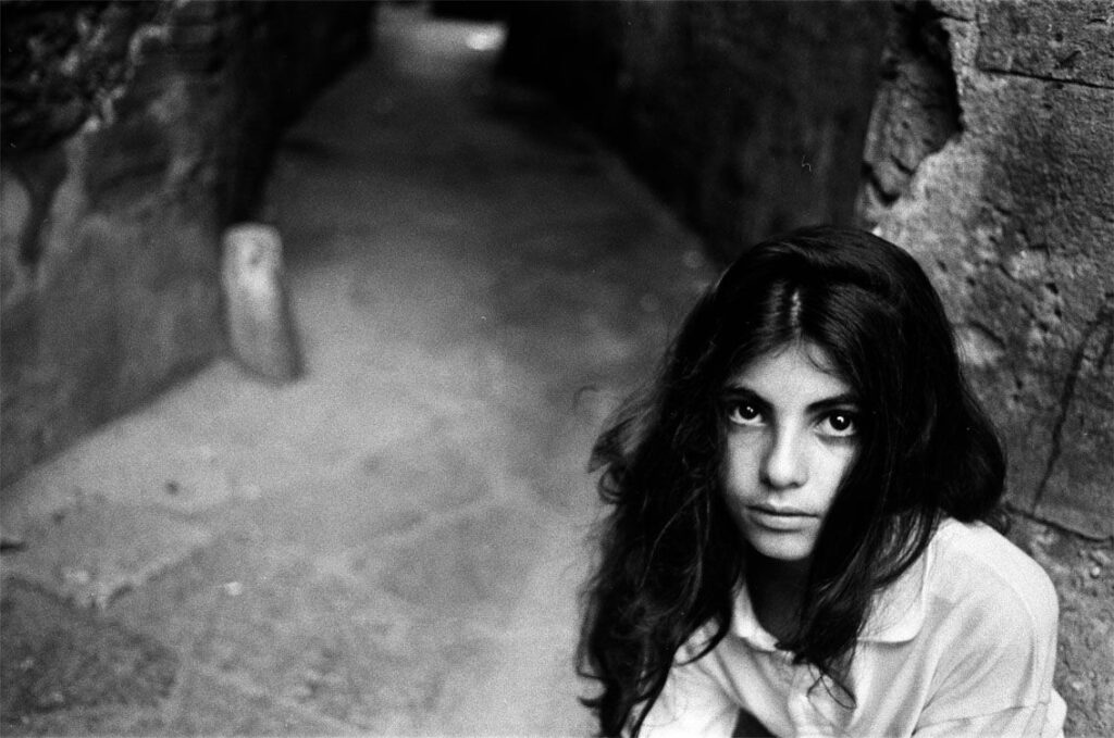 Letizia Battaglia: Letizia Battaglia, Near the Church of Casa Professa, Palermo, 1991, Letizia Battaglia Archive.
