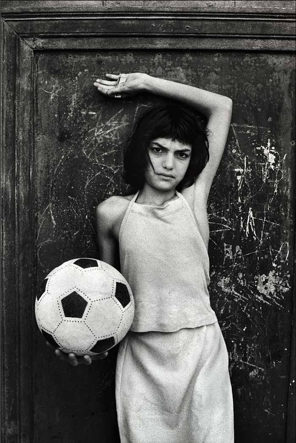Letizia Battaglia: Letizia Battaglia, The girl with the ball, La Cala district, Palermo, 1980, Letizia Battaglia Archive.
