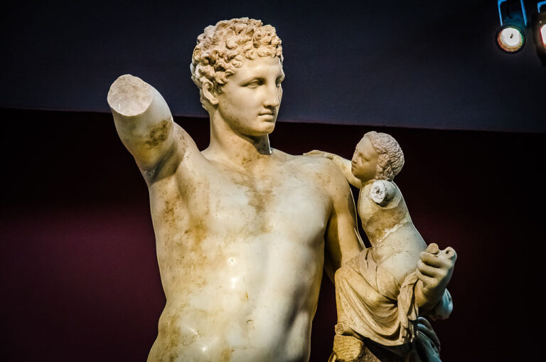 greek sculptures: Hermes and the Infant Dionysos, 4th Century BCE, Archaeological Museum of Olympia, Greece. Detail. Photograph by Made by Numbers via Wikimedia Commons (CC BY-SA 2.0).
