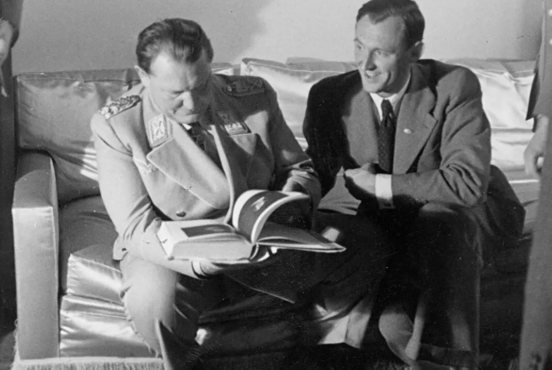 Göring and Lohse studying a book on Rembrandt.Credit. Photo: Archives des Musées Nationaux