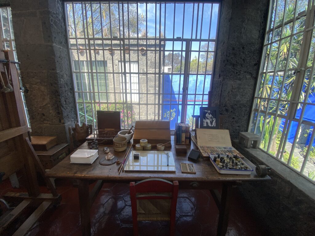 Frida Kahlo House: Frida Kahlo’s worktable, Frida Kahlo Museum, Mexico City, Mexico. Photo by Terin Christensen, 2025.
