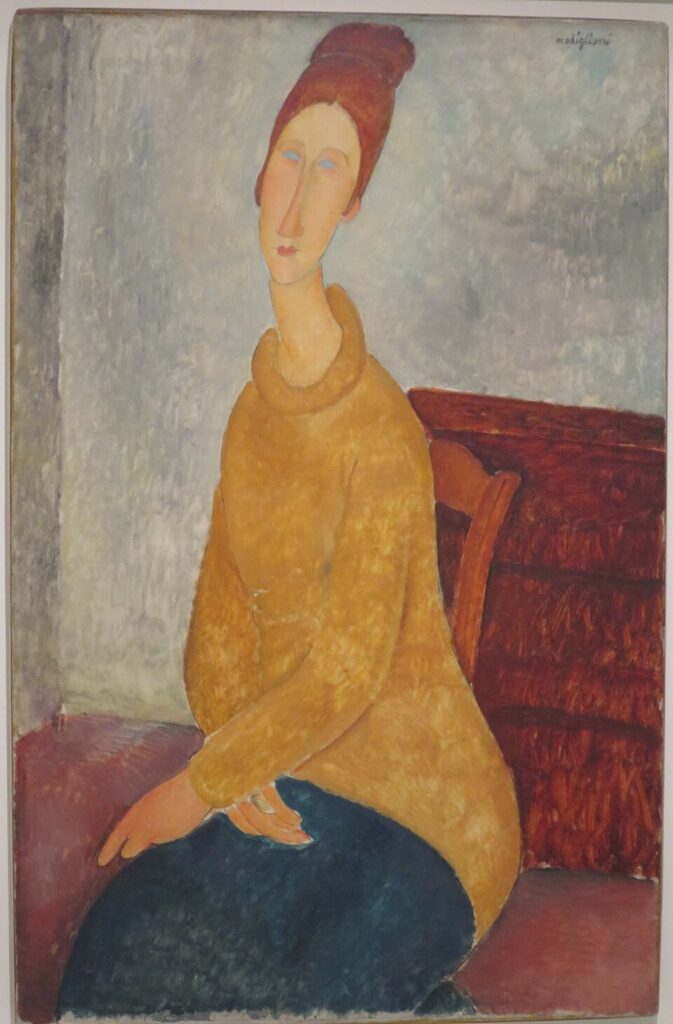 Amedeo Modigliani paintings: Amedeo Modigliani, Jeanne Hébuterne with Yellow Sweater, 1918, Solomon R. Guggenheim Museum, New York City, NY, USA. Wikimedia Commons (public domain).
