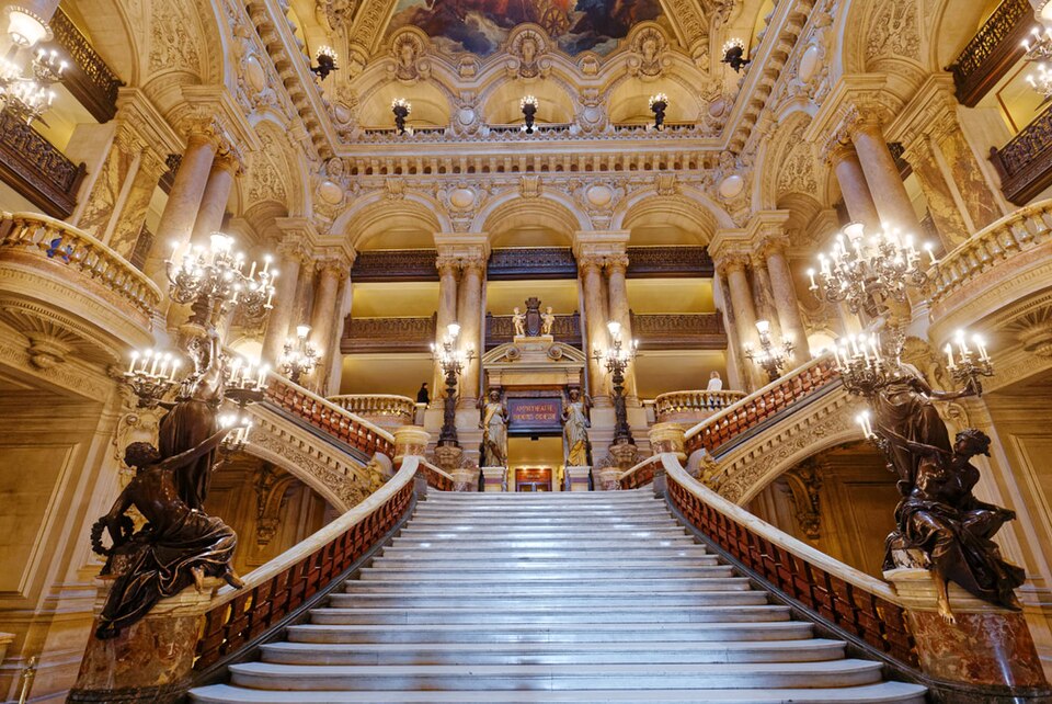 Opera Garnier: Grand Staircase, Opéra Garnier, Paris, France. Photograph by isogood via Wikimedia Commons (CC BY-SA 4.0).
