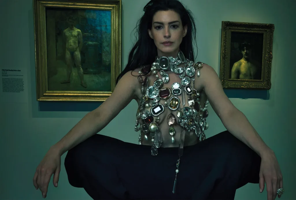 Anne hathaway photoshoot: Anne Hathaway in Givenchy by Sarah Burton and a Bvlgari High Jewelry ring at the Metropolitan Museum of Art. Photograph by Annie Leibovitz. Vogue.
