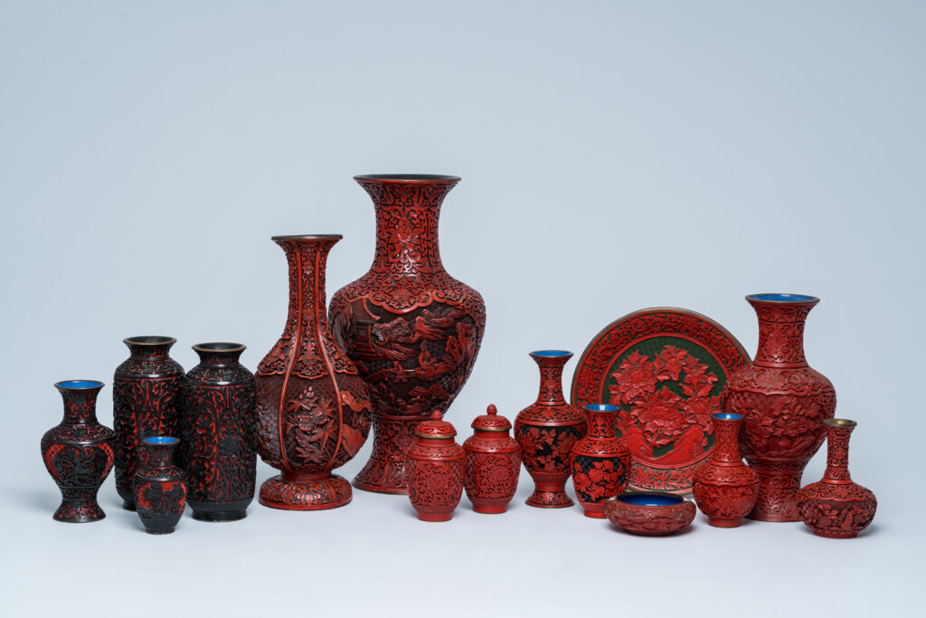 painters pigments: A collection of Chinese carved cinnabar and black lacquer vases, a plate, and a bowl with a floral design, 20th century. Coronari Auctions.
