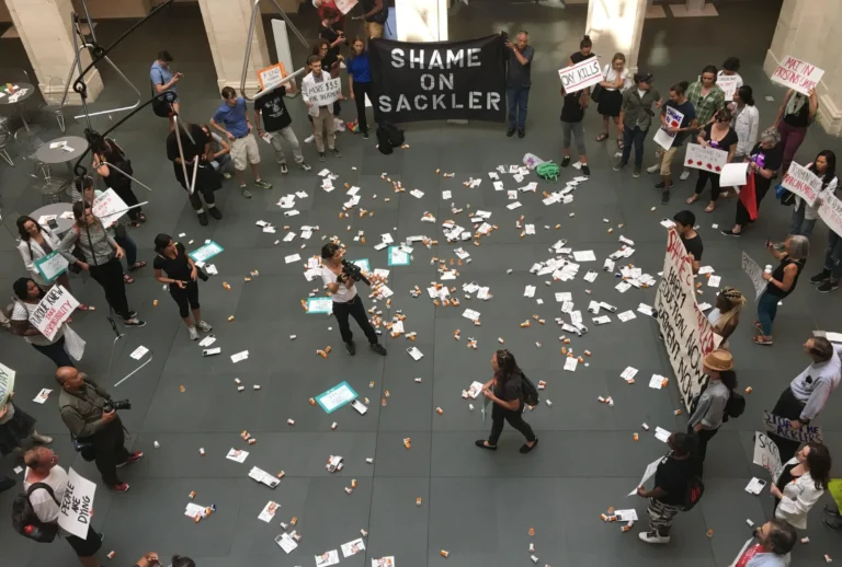 Nan Goldin: Nan Goldin, Shame on Sackler demonstration, 2019, Solomon R. Guggenheim Museum, New York City, NY, USA. PAIN. Detail.
