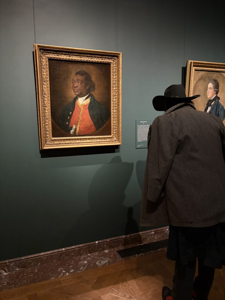 gainsborough fashion frick: A patron admires Ignatius Sancho’s portrait at Gainsborough: The Fashion of Portraiture, Frick Collection, New York City, NY, USA. Photograph by the author.
