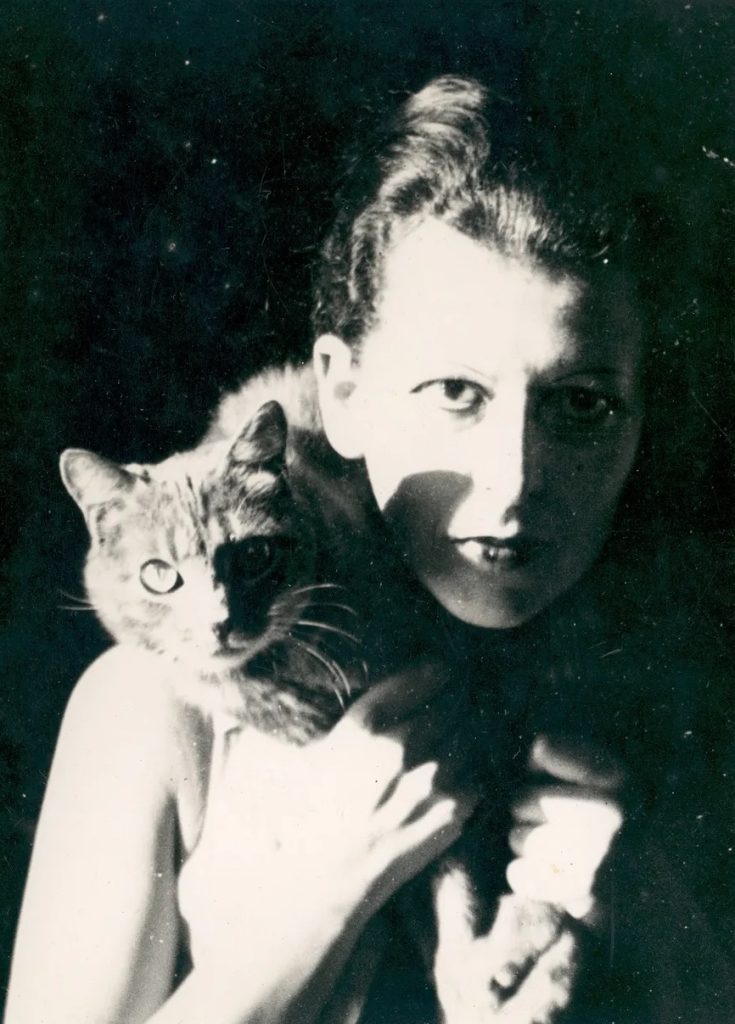 artists cats: Claude Cahun with their cat Kid, 1927, Jersey Heritage Trust, St Helier, Jersey, UK. The Cut.
