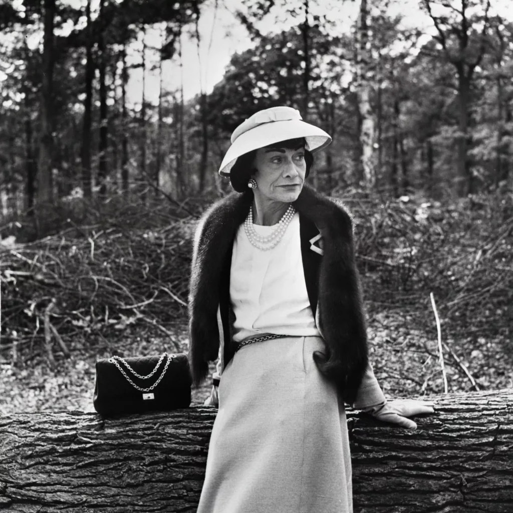 coco chanel designs: Gabrielle “Coco” Chanel with the 2.55 bag, 1957. Vogue Scandinavia.
