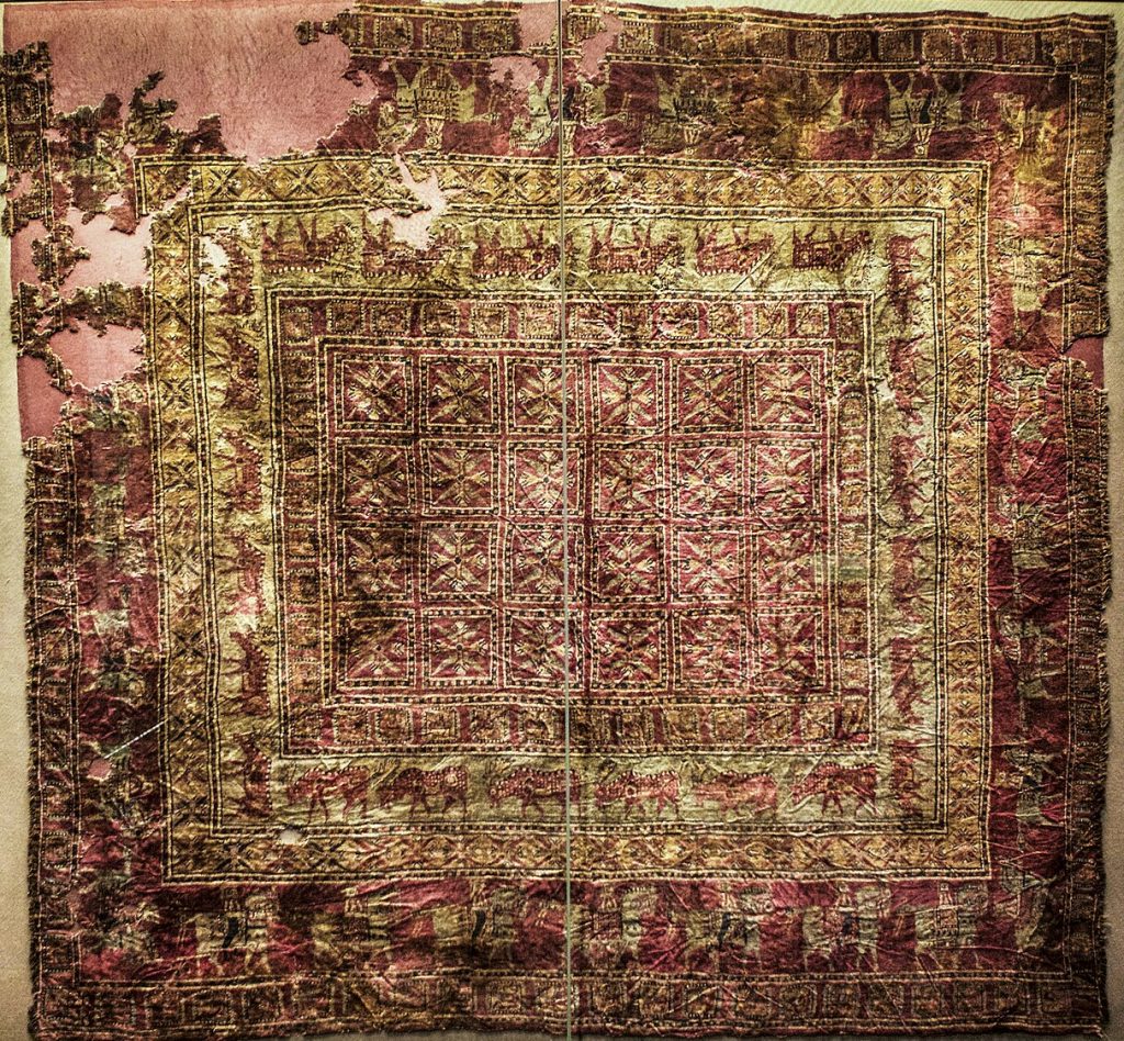 Persian Rug: Pazyryk Carpet, ca. 5th century BCE, Hermitage Museum, Saint Petersburg, Russia. Photograph by Ninara via Wikimedia Commons (CC-BY-2.0).
