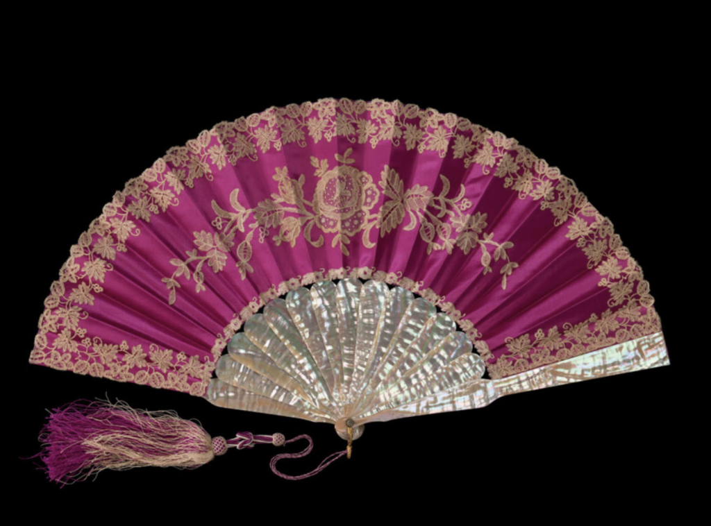 gilded age fashion: Fan in purple satin, Tiffany & Co, 1890s. Elizabeth L. Block, Gilded Age Fashion, 2026, Hardie Grant Books, p. 90.
